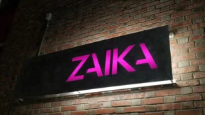 Custom CNC halo lit metal sign for Zaika in Seattle Washington