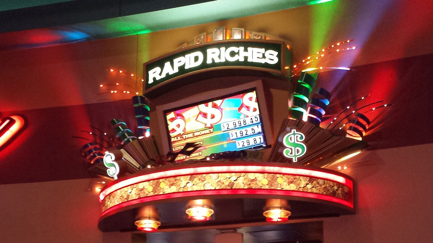 Rapid Riches custom themed sign with tv screens