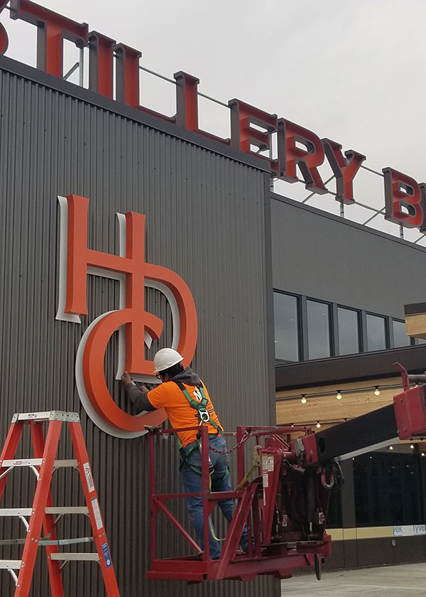 Sign installation for Eagle One Distillery in Rochester, WA by New Image Creative